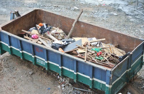 Construction site with workers managing waste