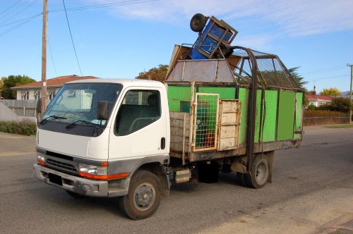 Workers loading rubbish during a shop refit in Chessington